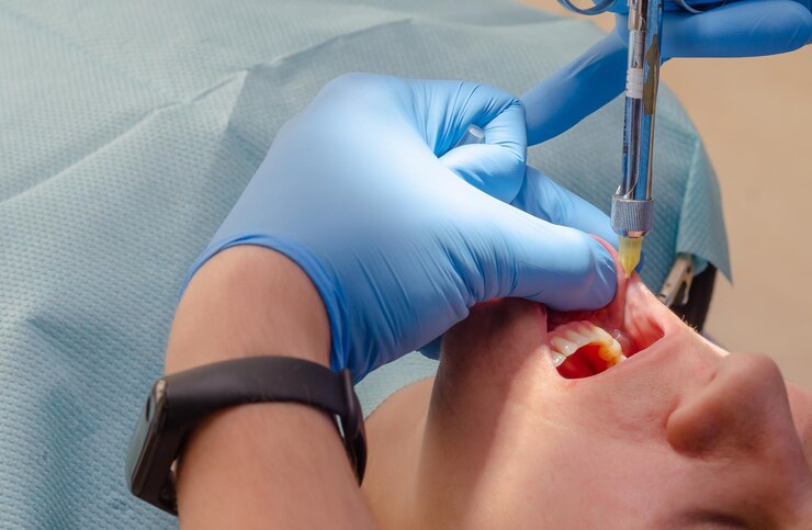 doctor-gives-anesthetic-injection-patient-dental-clinic_137416-3669