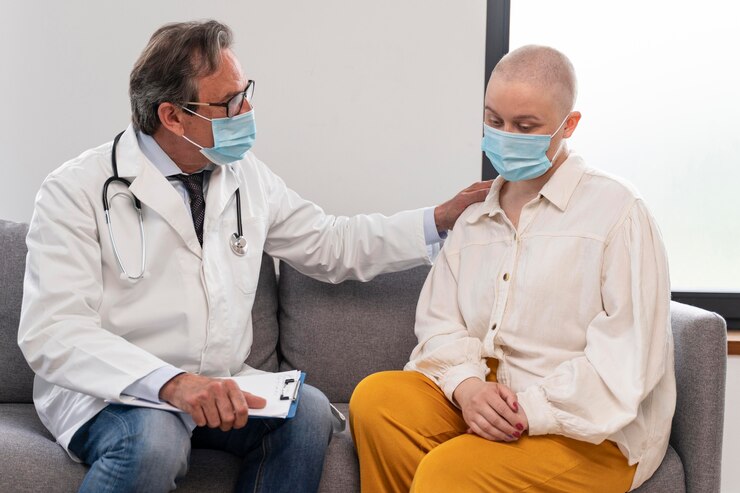 young-woman-suffering-breast-cancer-talking-with-her-doctor_23-2148992310