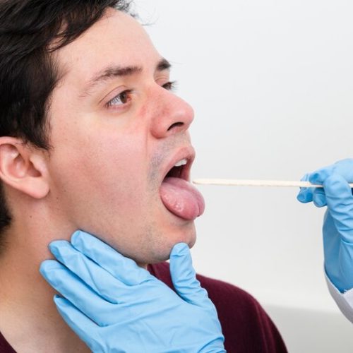 close-up-examination-with-tongue-depressor_23-2148231303