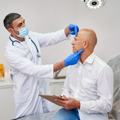 doctor-with-man-before-aesthetic-operation-medical-clinic_218872-167