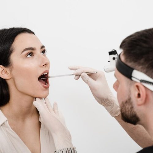 ent-doctor-examines-woman-throat-with-spatula-consultation-with-otolaryngologist-girl-opens-her-mouth-ent-doctor-examines-sore-throat_255847-11214