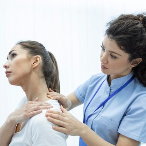 woman-doctor-osteopath-medical-uniform-fixing-woman-patients-shoulder-back-joints-manual-therapy-clinic-visit-professional-osteopath-work-with-patient-concept_1212-7127